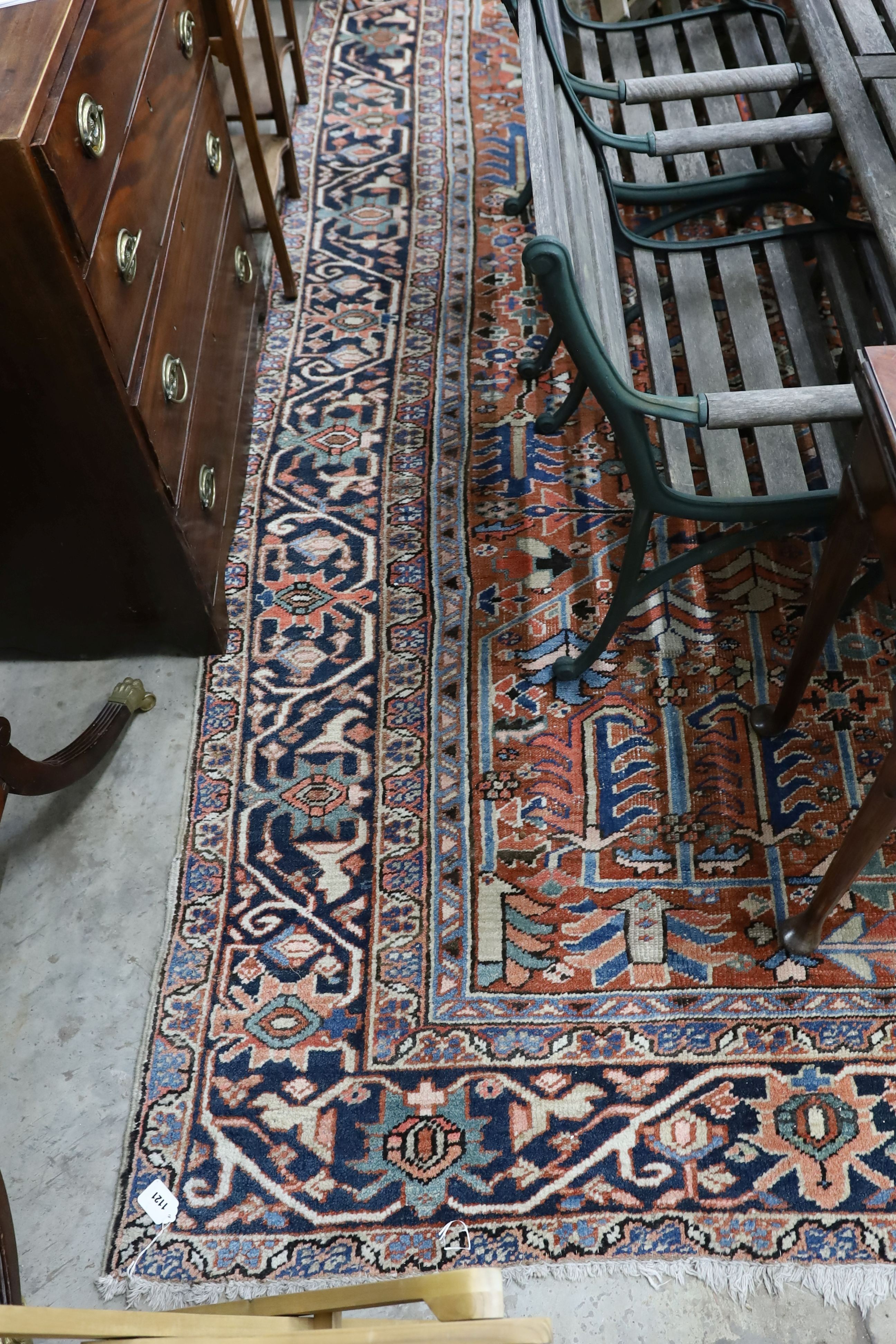 A Caucasian red ground carpet, 390 x 285cm